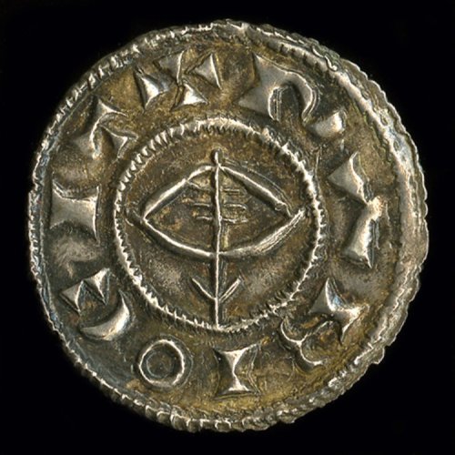 artofthedarkages:A Viking penny with an image of Thor’s hammer with a “Hand of God” resting on top o