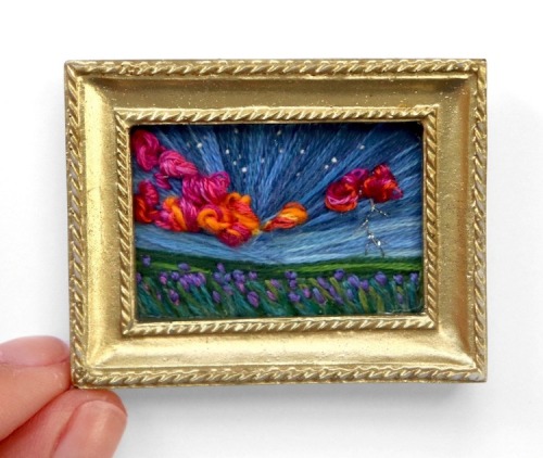 Caroline Torres stitches embroidery art that look like miniature landscape paintings.