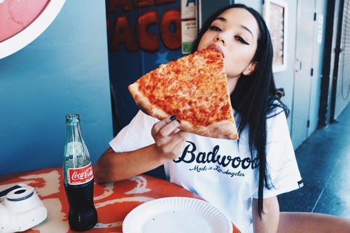 Girl eating pizza