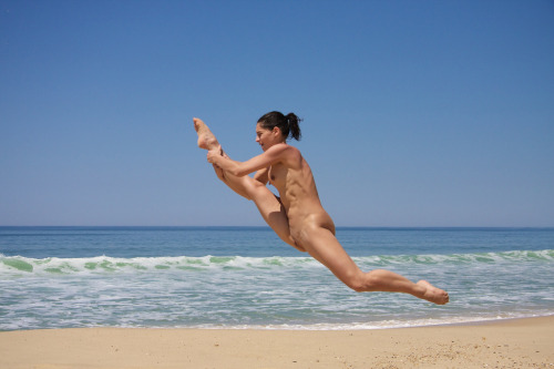 XXX Dancer training on nude beach. photo