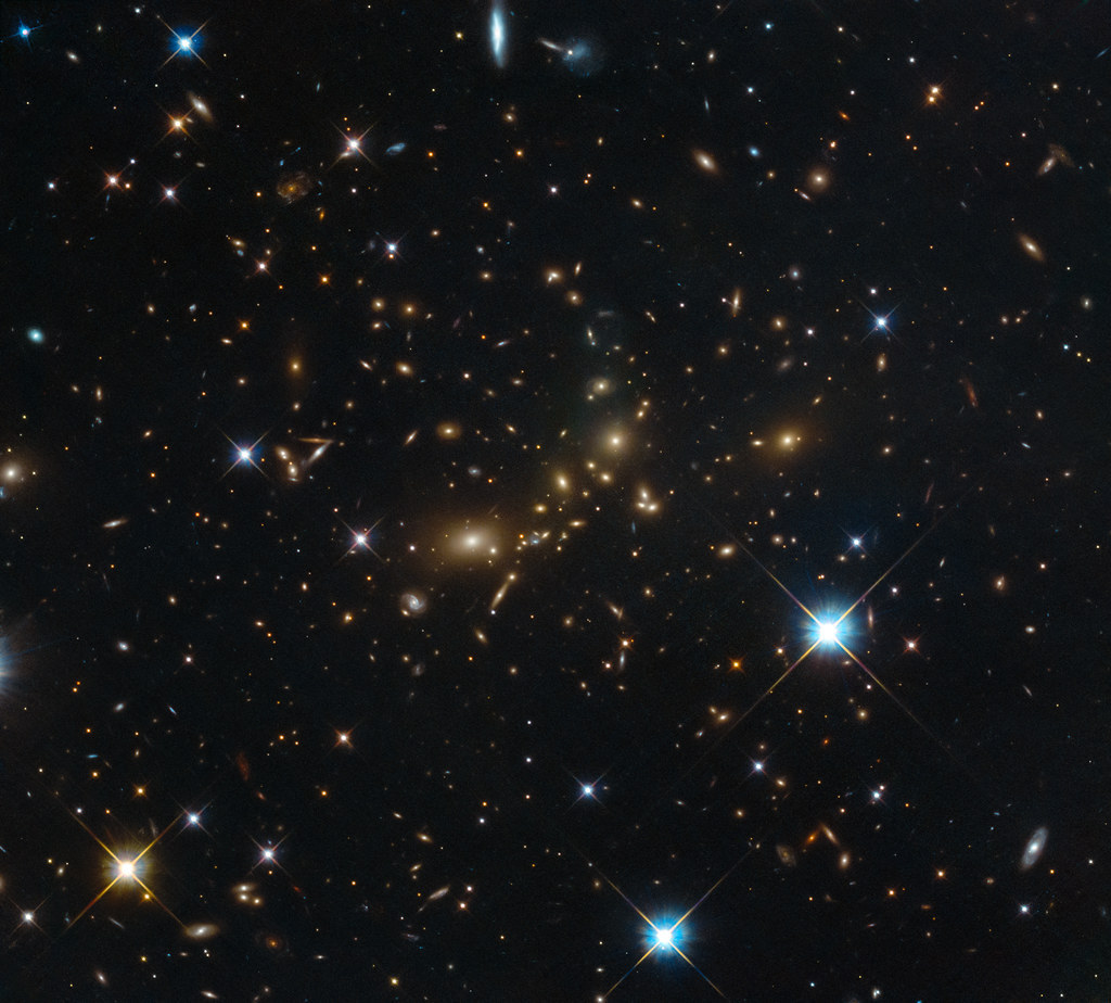 Who wins the celestial showdown of galaxy clusters vs. superclusters? by NASA Goddard Photo…