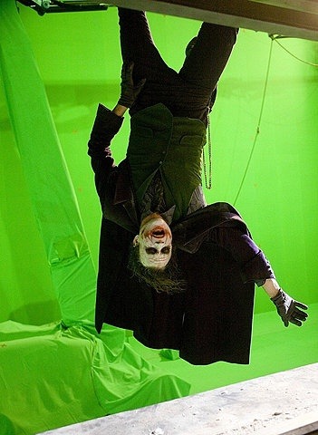 Just another lunatic hangin’ out (Heath Ledger is suspended in front of a “green