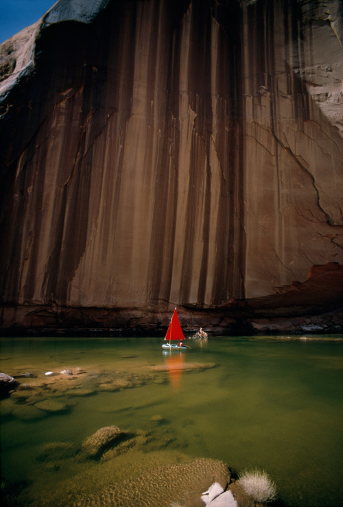 Iron and manganese seepage creates streaks on a sandstone wall on Lake Powell in Utah, July 1967.Pho