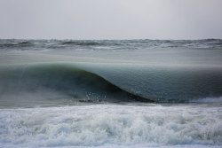 sixpenceee:  Freezing Ocean Waves In Nantucket Are Rolling In As Slush  It’s so cold that the sea on the coast of Nantucket, an island on the eastern coast of the U.S., has turned into slush! Jonathan Nimerfroh, a photographer and surfer who’s 