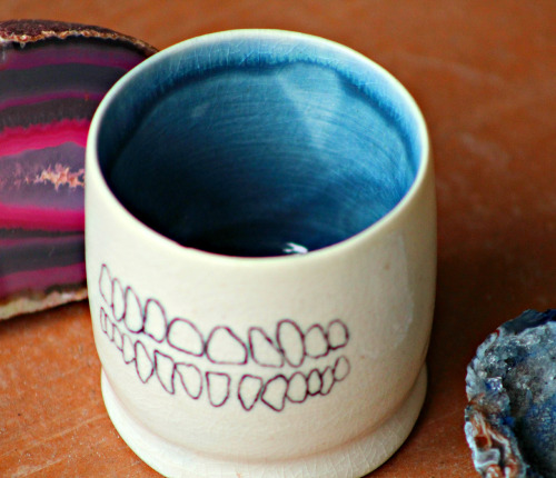 xcatalicious:  This one’s for my tea drinking homies! Wheel thrown porcelain tea cup with human teeth and dog jaw bone hand painted on opposite sides covered in a cracking clear glaze. You can buy it right hurrrr if you want…not trying to force anything,