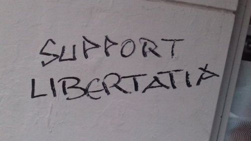 Solidarity graffiti for Libertatia, a squatted anarchist social centre in Thessaloniki, which was to