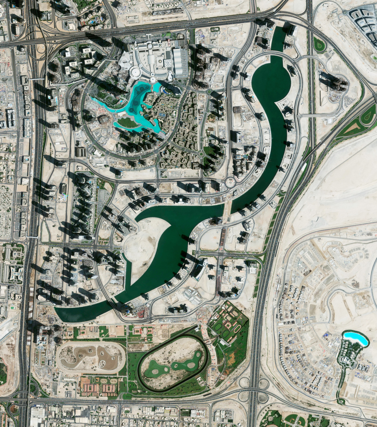 dailyoverview:  The skyscrapers of Dubai cast long shadows over the landscape. The