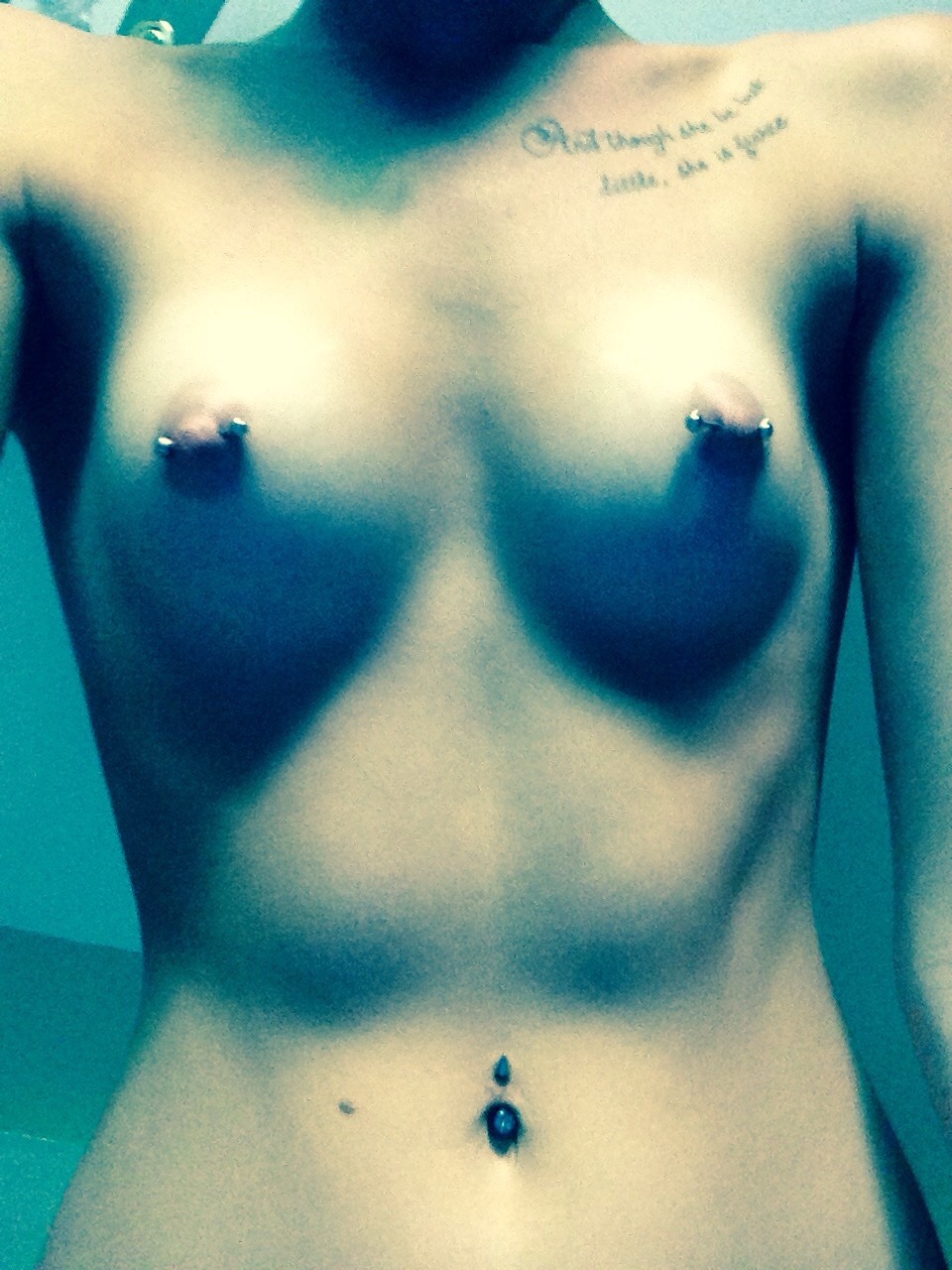 rolledtightmarie:In love with my piercings and the lighting in my roomm!