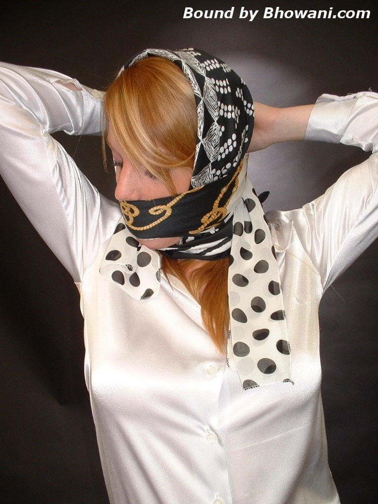 graybandanna:  A headscarfed Fi Stevens gags herself with 2 more scarves 