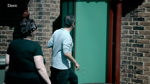 [ID: Four screencaps from Taskmaster. Jo Brand stands in a garden, pointing at the black back door o