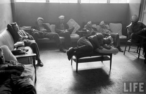 Sailors take a break during a search for a missing B-29(Michael Rougier. 1949)