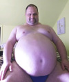 bigblackirish:My beautiful bellyboy.  That big gut is gonna take a lot of punches.