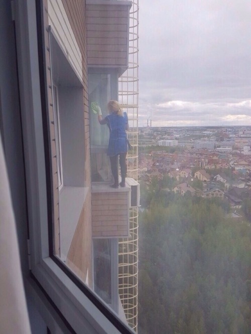 weirdrussians:In Surgut, a woman was spotted washing windows on 19th floor.