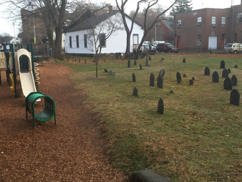 sixpenceee:A playground next to an 18th century cemetery. (Source)