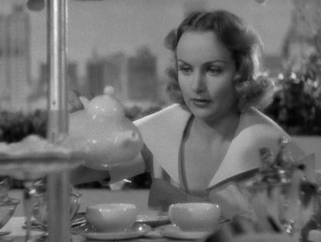theidentitymad:Carole Lombard attempts to pour tea in Hands Across the Table (1935)