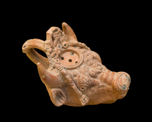 Ancient Greek terracotta lamp in the shape of a bull’s head.  Artist unknown; 2nd cent. BCE.  Now in