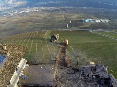 the-gas-station:  Rolling Stones Picture: Last Tuesday, a landslide in Northern Italy produced two huge boulders that barely missed a farmhouse and destroyed a nearby barn as they plowed their way downhill. © Tareom, Source 