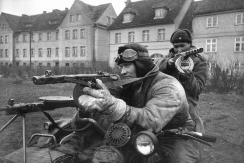 Russian patrol on their Dnepr M-72 motorcycle, Germany 1945.