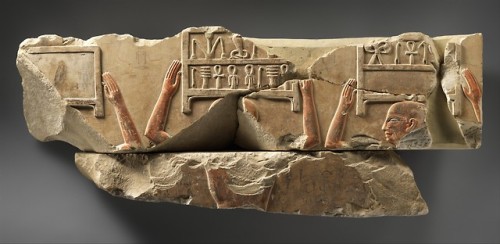 Ancient Egyptian relief (painted limestone) depicting men carrying boxes of offerings.  Artist 