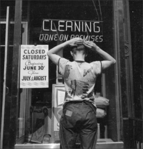 1950sunlimited:  young man combing his hair in the store window reflection, 1950s 