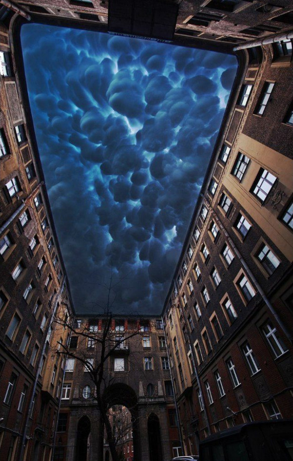 evilbuildingsblog:  Tolstoy House in St Petersburg underneath mammatus clouds