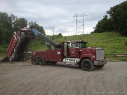 semitrckn:  Mack Superliner Wrecker helping dump a newer Mack Dump