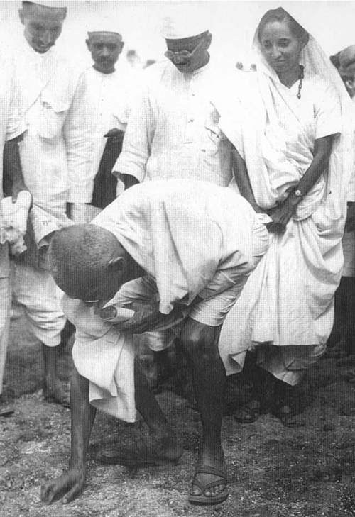 Mohandas Gandhi breaks the salt laws, 1930. 