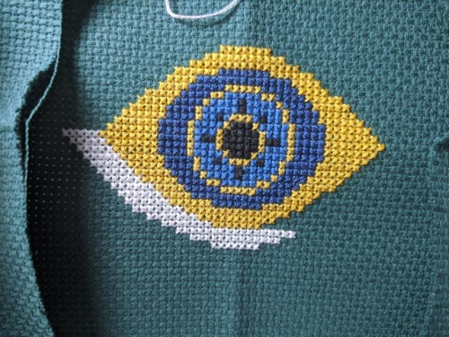 Progress on my evil eye cross stitch