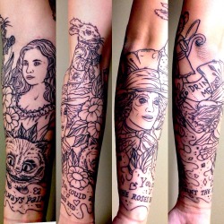 fuckyeahgirlswithtattoos:  My Alice in Wonderland forearm sleeve, done by William Dootlittle at Studio City Tattoo.