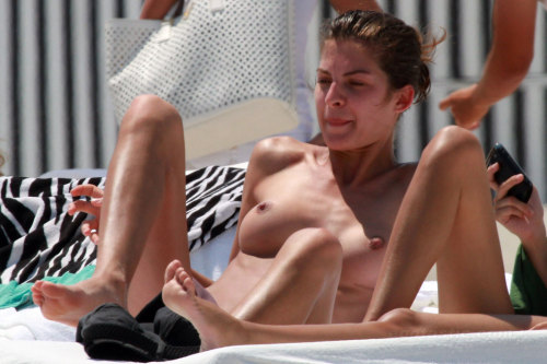 toplessbeachcelebs:  Yaya Kosikova (Model) sunbathing topless in Miami Beach (March 2011) 