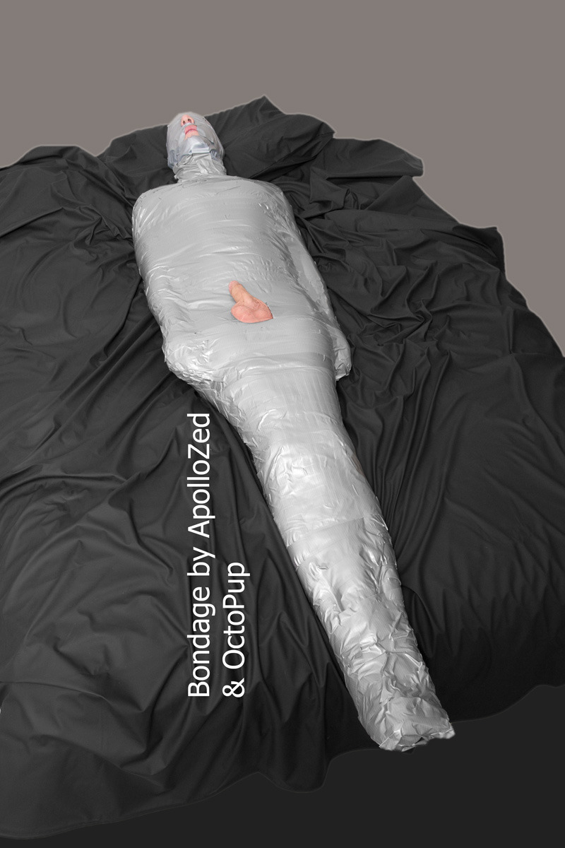 apollozed:FetishLA mummified. Duct tape on body and vinyl tape on head. Assistance