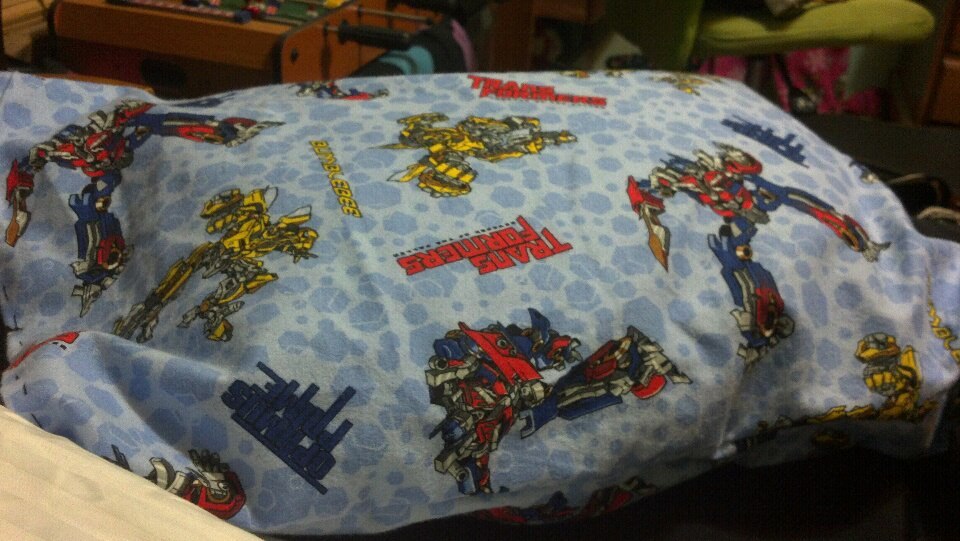 This is a hand sewn Transformers pillow I made for my love, PatticusPrime &lt;3