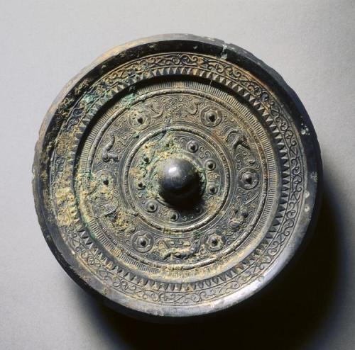 Mirror with Concentric Circles, an Immortal, and Auspicious Animals, 1st century, Cleveland Museum o