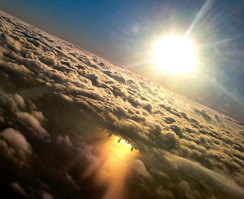 blazepress:  Chicago reflected in Lake Michigan from an airplane.