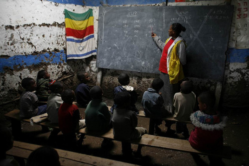 ofskfe:Ethiopian Jewish children learning Hebrew in a transit camp near Gondar, Ethiopia. Photograph