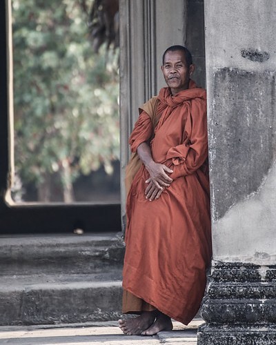 Cambodian Monk at Angkor Wat. I spotted this guy in the distance and motioned through improvised sign language if I could take his photo, he nodded kindly letting me get this shot. #travel #telephoto #canon #tamron #cambodia #monk #angkorwat #culture...