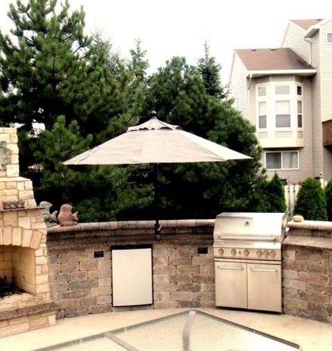 Chicago PatioPatio - Mid-sized Southwestern Backyard Concrete Patio Idea With A Fire Pit And No Cover