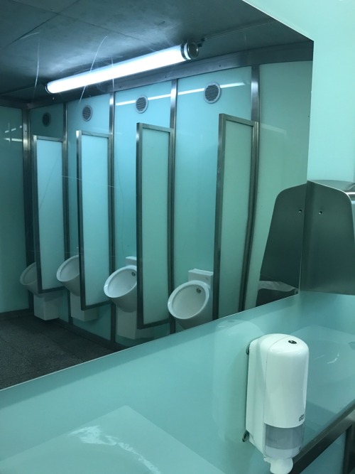 worldofurinals:  Free public restroom under a bridge in Gent, together with the bicycle parking. Lots of glass and steel.