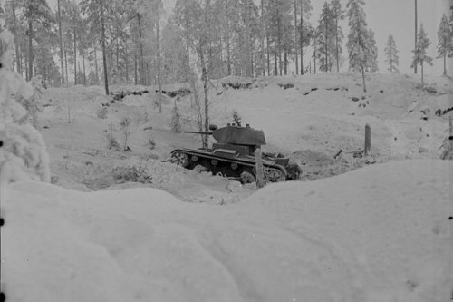 A Soviet T-26 tank (model 1937) advancing on the eastern side of the Kollaa River, during the Battle