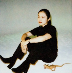 fernsandmoss:  Nobuyoshi Araki - Untitled (Sitting Girl with Lizard) 
