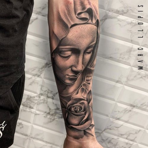 Amazing Virgin Mary Pieta rose tattoo by @marcllopistattoo !