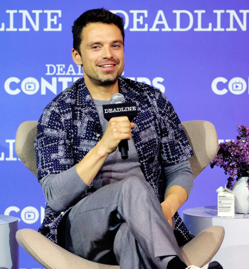  Sebastian Stan and Lily James speak onstage during Hulu’s ‘Pam & Tommy’ panel