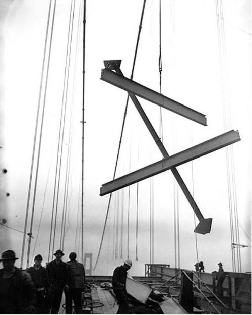 Girders being removed from the collapsed Tacoma Narrows Bridge during salvage operations,  1941