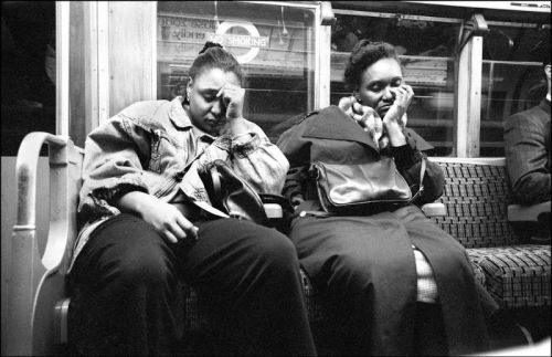 32 candid photographs of the London Underground in the late 1980s.