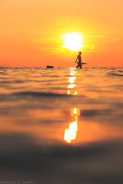 capturedphotos:  The Water Walker A fisherman walks along the shore of Calatagan, Batangas during the low tide in search of creatures of the sea.  Photographed by: Paolo Nacpil   