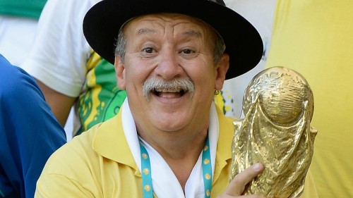 Trivia from the “sad guy with a mythical moustache holding the World Cup trophy”, and some happy pictures of him! His name is Clovis Acosta Fernandes, also known as “Gaúcho da Copa”. He’s 59 years old and works as a real