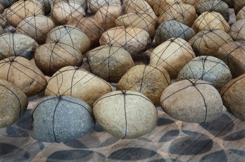 onpyre:Ken Unsworth. Suspended stone circle II103 river stones, wire. 400.00 cm diam. overall