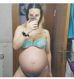 paternalstranger:  nonudepregs:  Follow me on : http://nonudepregs.tumblr.com/  Her bikini from Spring Break still fit, but that was all.  She’d gradually grown out of the rest of her clothes, not even realizing she was knocked up until she’d passed