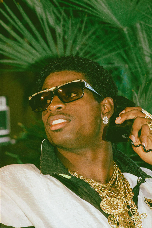 strappedarchives:  Deion Sanders photographed David Banks while listening on the phone as he waits for the announcement of him being drafted to the Atlanta Falcons at his agent’s home in Winnetka, Illinois - April 23, 1989