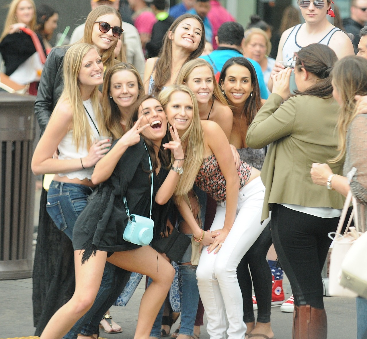 I like the cleavage on the dark haired one in the back.